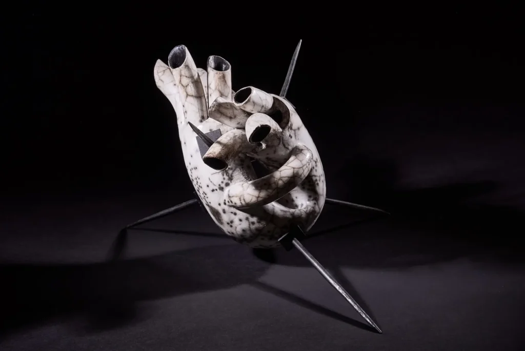 Balance — Raku ceramic heart sculpture with forged metal spikes. Studio Willis.