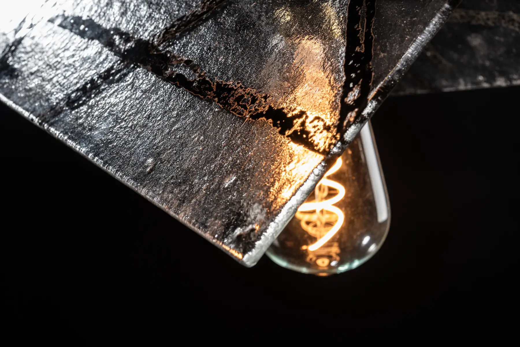 Close Up, Glass and Bulb — Fritz Fryer Lighting, close up of screen printed glass and exposed filament bulb. Studio Willis.