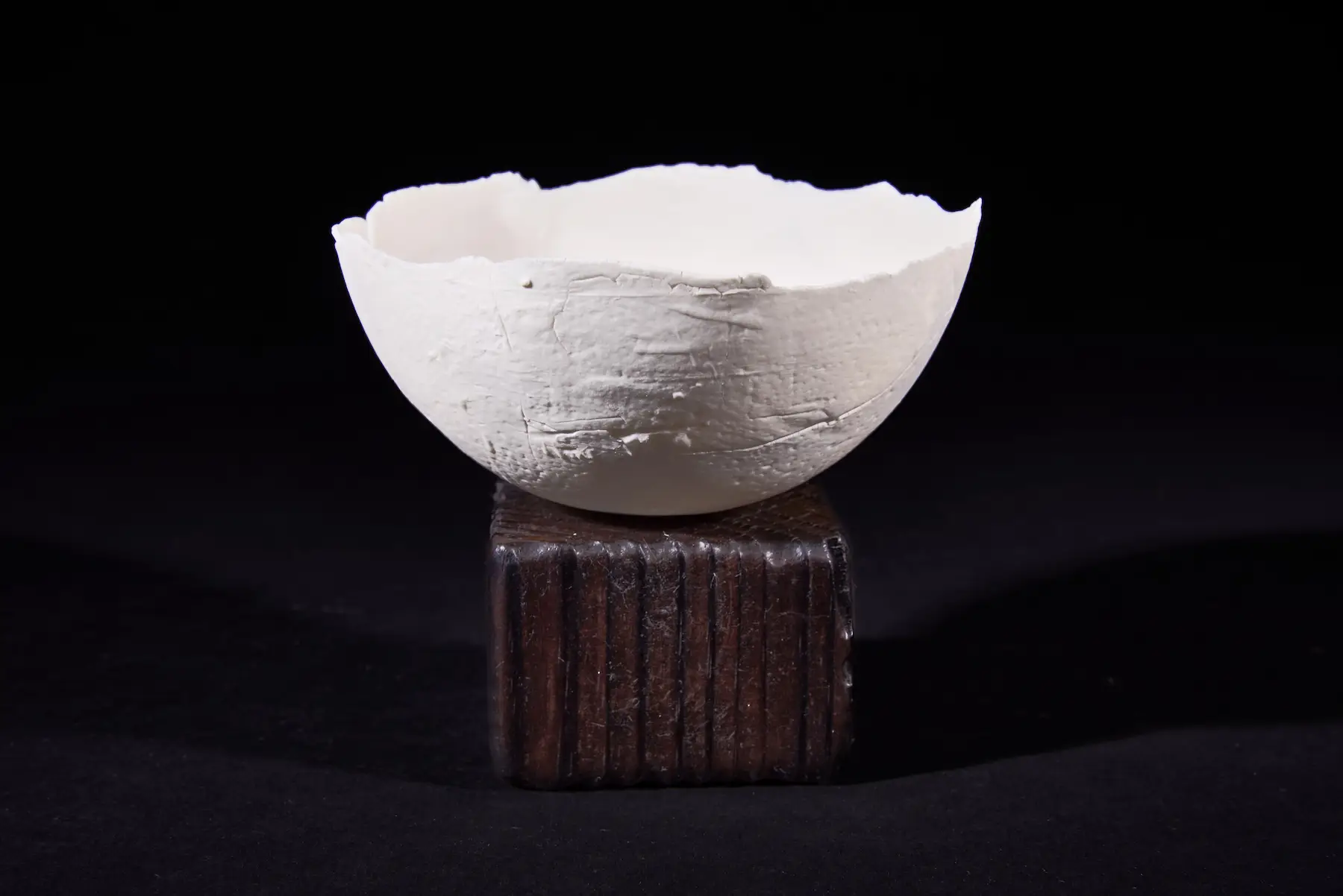 Scrap Paper, Individual — Screwed Up, single rough-textured hand-built porcelain bowl mounted on dark wood. Studio Willis.