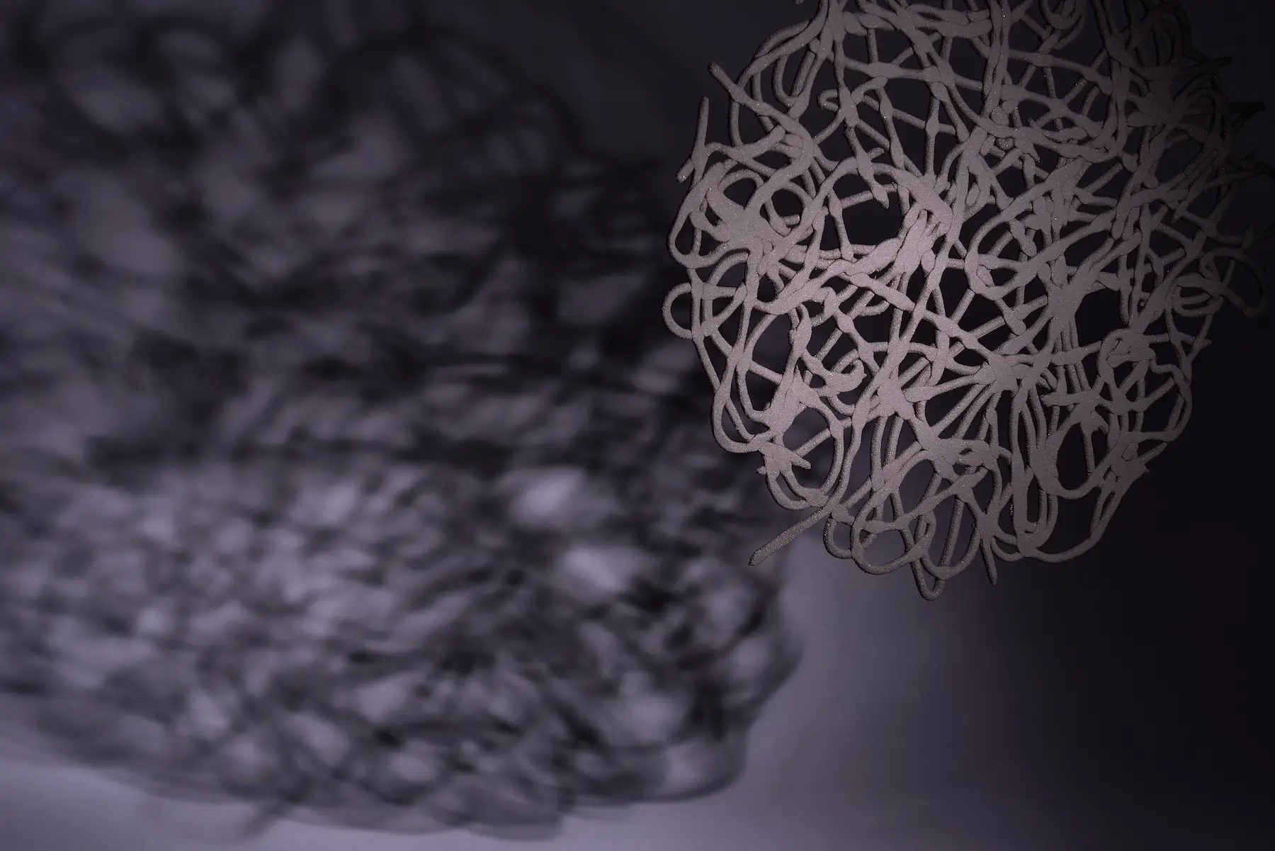 Scribble, Suspended — Screwed Up, black stoneware scribble form suspended in air. Studio Willis.